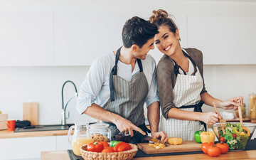 Image of a couple cooking in the kitchen